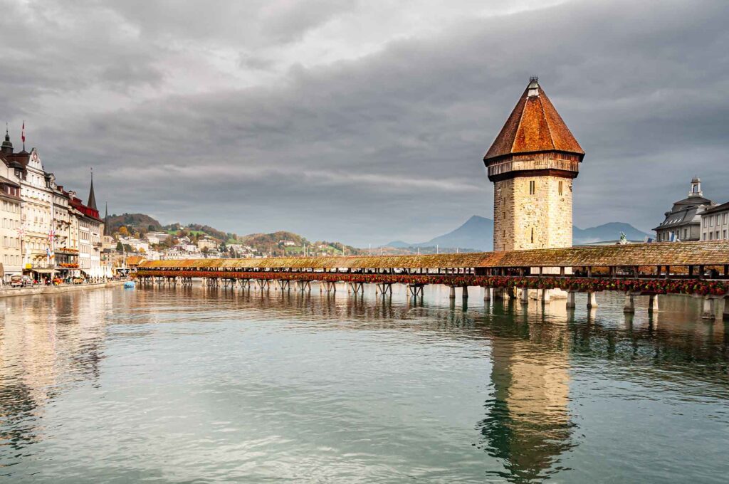"Iconic Kappelbrücke in Switzerland - Explore the Rich History and Charm of Lucerne's Covered Wooden Bridge