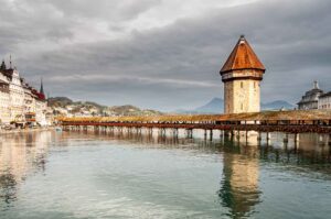 "Iconic Kappelbrücke in Switzerland - Explore the Rich History and Charm of Lucerne's Covered Wooden Bridge