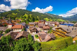 Gstaad: A prestigious Swiss ski resort town known for its luxurious charm, stunning alpine views, and premier skiing facilities
