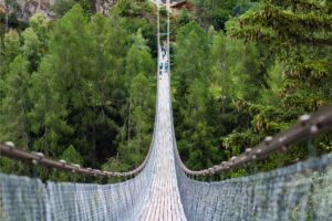 Quaint wooden bridge nestled in the picturesque town of Zermatt, surrounded by the Swiss Alps