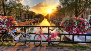 Amsterdam: A vibrant cityscape with picturesque canals, historic architecture, and a lively atmosphere, capturing the essence of Dutch culture and urban charm